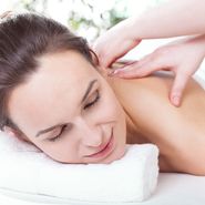 Pretty lady having nice neck massage, horizontal